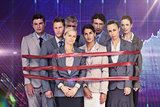Composite image of upset business team fastened with adhesive tape