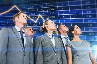 Composite image of business team looking up