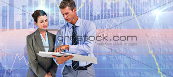 Composite image of business team looking at folder