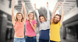 Composite image of smiling celebrating girls jumping up