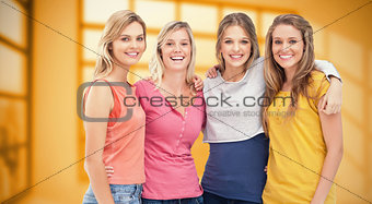 Composite image of four friends standing beside each other and smiling