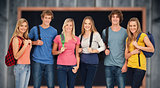 Composite image of smiling group with backpacks on as they smile