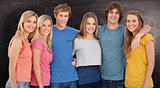 Composite image of a group of friends smiling and holding each other