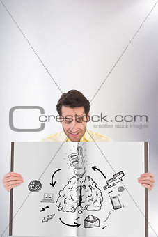 Composite image of man showing a book