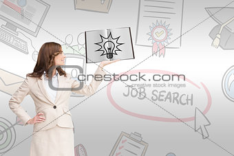 Composite image of pretty businesswoman showing a book