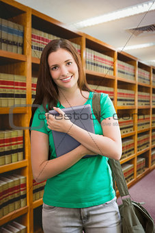 Composite image of student using her tablet in library