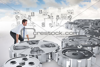 Composite image of strong businessman lifting up something