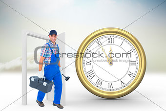 Composite image of happy plumber with plunger and toolbox walking on white background
