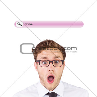 Composite image of geeky businessman looking at camera