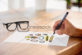 Composite image of side view of hand writing on white page on working desk