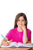Composite image of cute pupil working at her desk