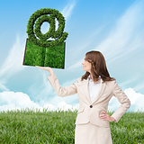 Composite image of woman holding lawn book