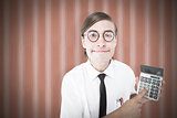 Composite image of geeky smiling businessman showing calculator