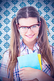 Composite image of geeky hipster smiling at camera