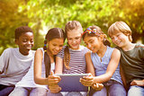 Composite image of children using digital tablet at park