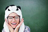 Composite image of geeky hipster smiling at camera
