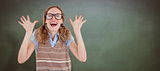 Composite image of geeky hipster woman smiling and showing her hands