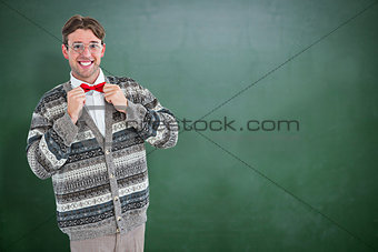 Composite image of happy geeky hipster with wool jacket