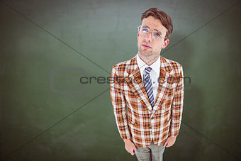 Composite image of geeky hipster looking up