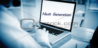 Next generation against businessman working on his laptop