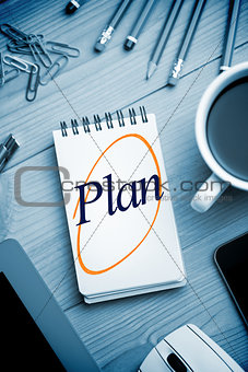 Plan against notepad on desk