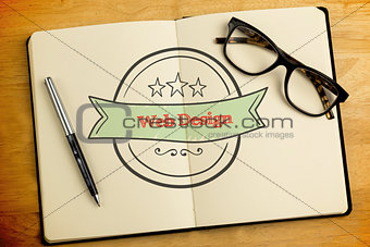 Web design against overhead of open notebook with pen and glasses