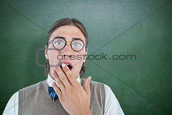 Composite image of geeky hipster looking surprised at camera