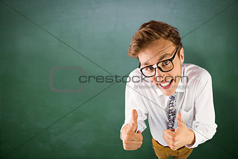 Composite image of young geeky businessman showing thumbs up