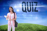Quiz against green hill under blue sky