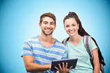 Composite image of students using tablet and smiling