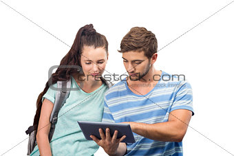 Composite image of students using tablet pc