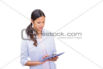 Composite image of woman using tablet pc