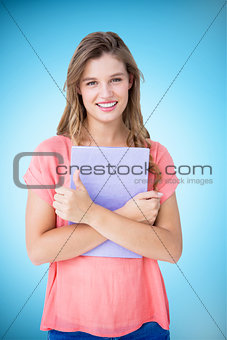 Composite image of pretty hipster holding notepad