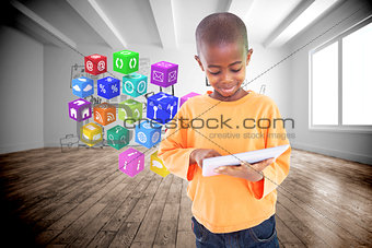 Composite image of cute boy using his tablet pc