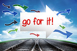 Go for it! against railway leading to blue sky