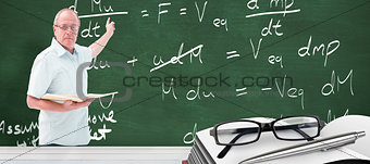 Composite image of teacher holding book and pointing