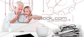 Composite image of mature students using laptop