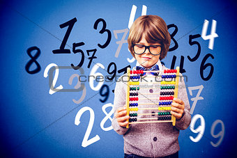 Composite image of pupil holding abacus