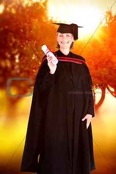 Composite image of happy blonde girl celebrating success with diploma
