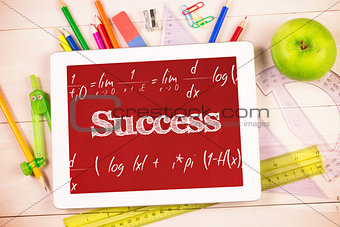 Success against students desk with tablet pc