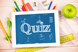 Quiz against students desk with tablet pc