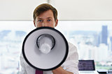 Portrait Confident Business Man With Megaphone In Office