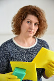 Woman thinks about the upcoming cleaning in  house