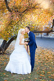 The groom gently hugged the bride