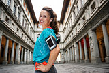 Portrait of smiling fitness woman with mp3 player, Florence