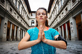 Young fitness woman in sports outfit is doing yoga. Florence