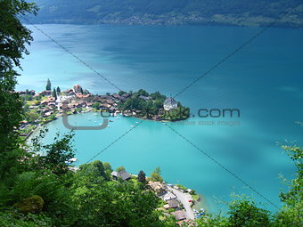 View down onto Swiss fishing village of Iseltwald on Brienzersee Lake