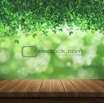 Wooden deck on a green leaves background