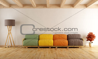 White lounge with colorful pallet sofa