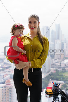 Portrait Manager Mother With Little Daughter In Office